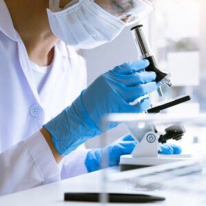 stem cell doctor examining a medical sample for stem cell injections