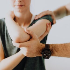 doctor examining a patient’s arm